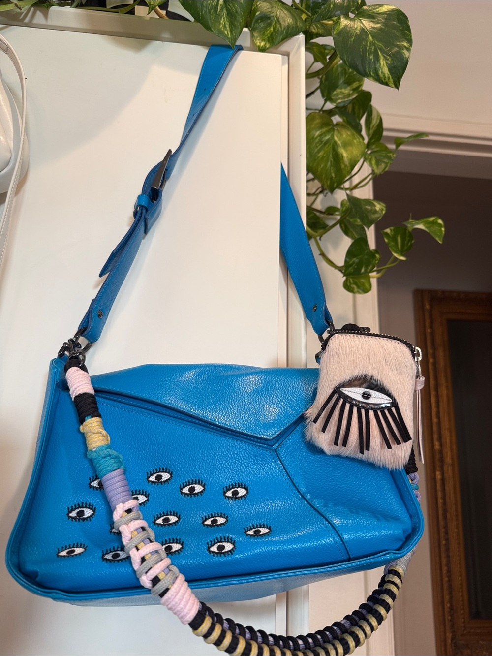 Blue Eye-Embellished Shoulder Bag with Decorative Strap